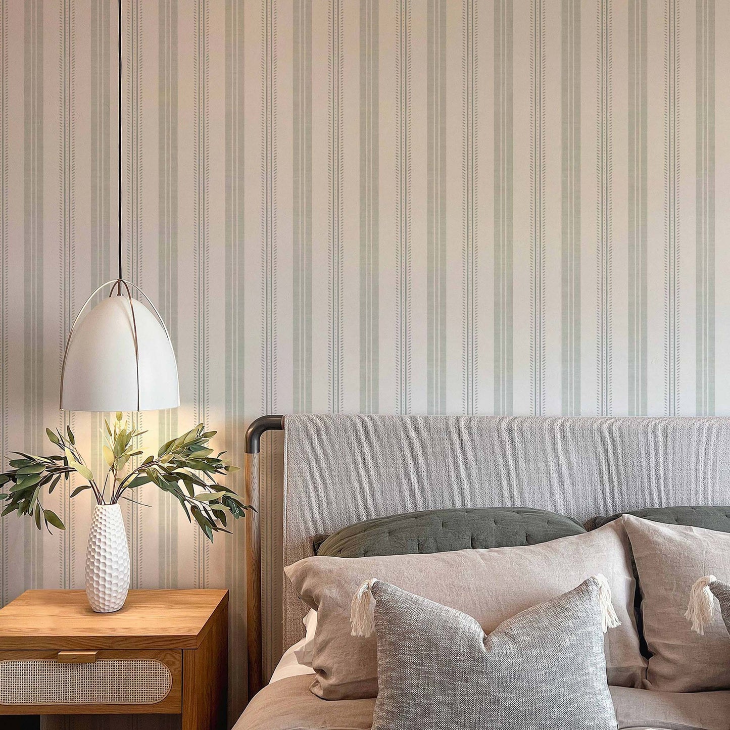 Antique Linen Stripes in Sea Salt on Cream shown in a bedroom.