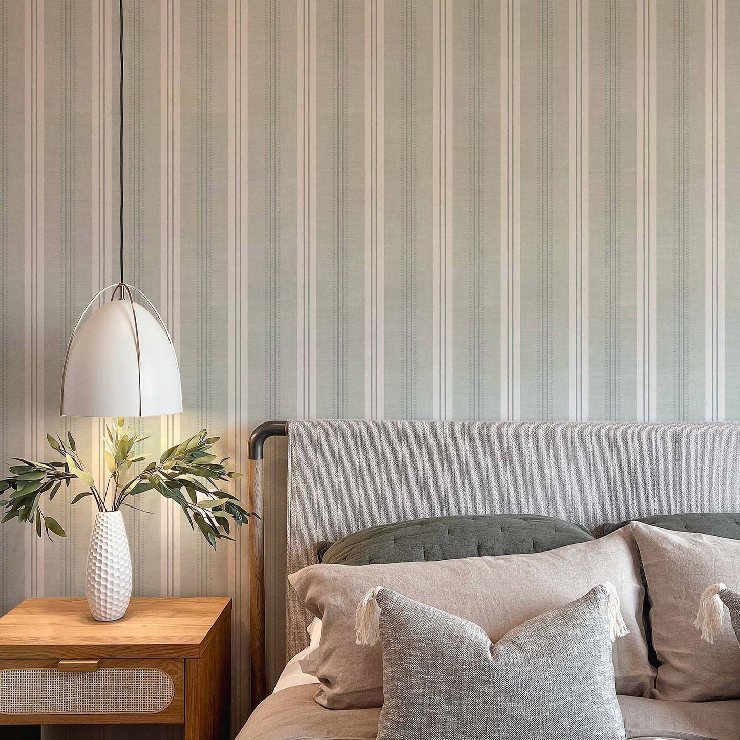 Antique Linen Stripe Wallpaper in Sea Salt shown in a bedroom
