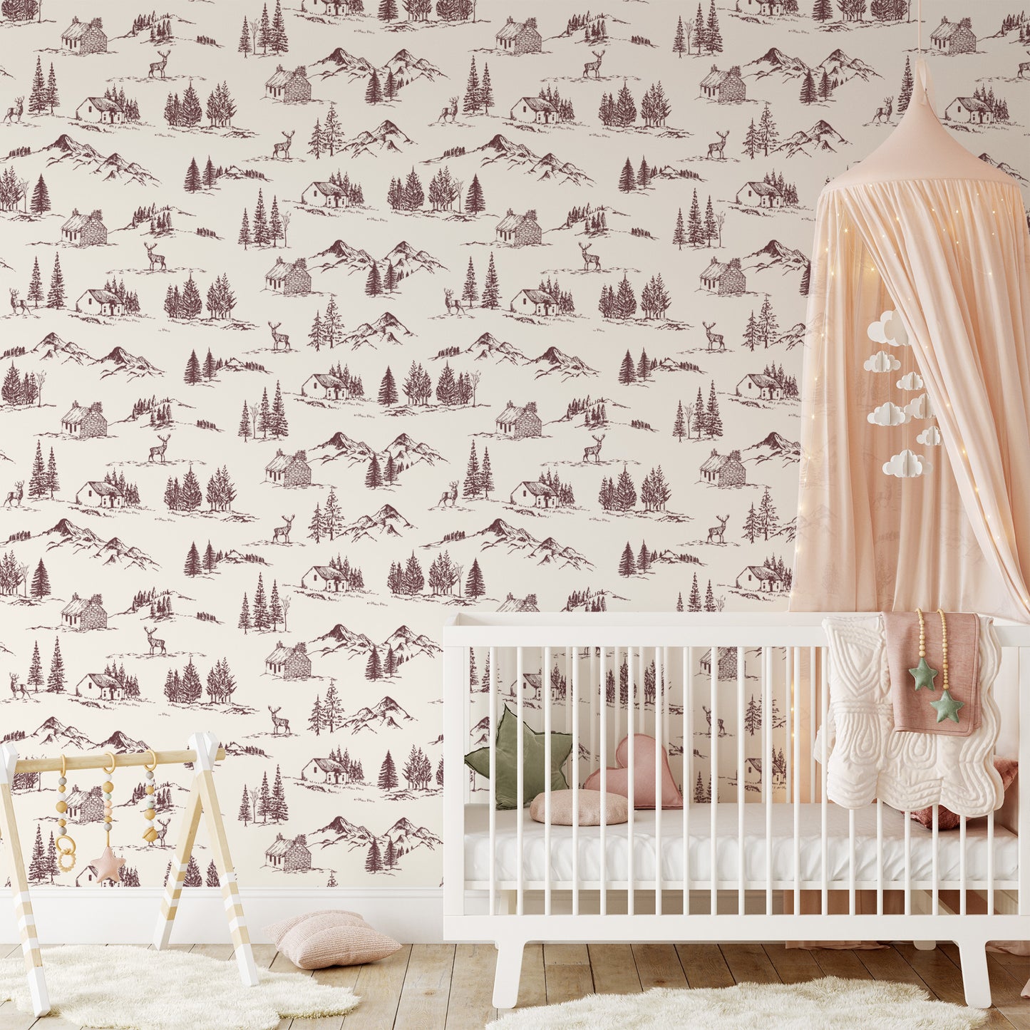 Winter Valley Toile Wallpaper in Burgundy shown in a nursery
