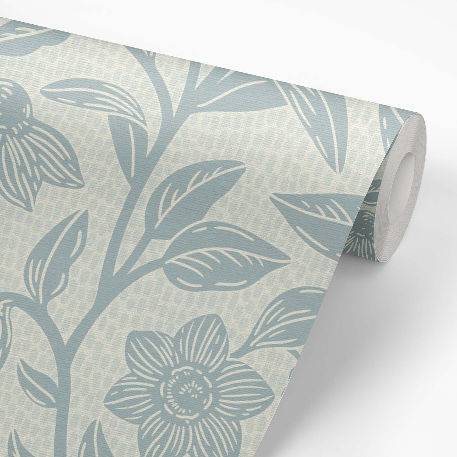 Block Printed Floral Vines Wallpaper in Cloudy Blue shown on a roll of wallpaper