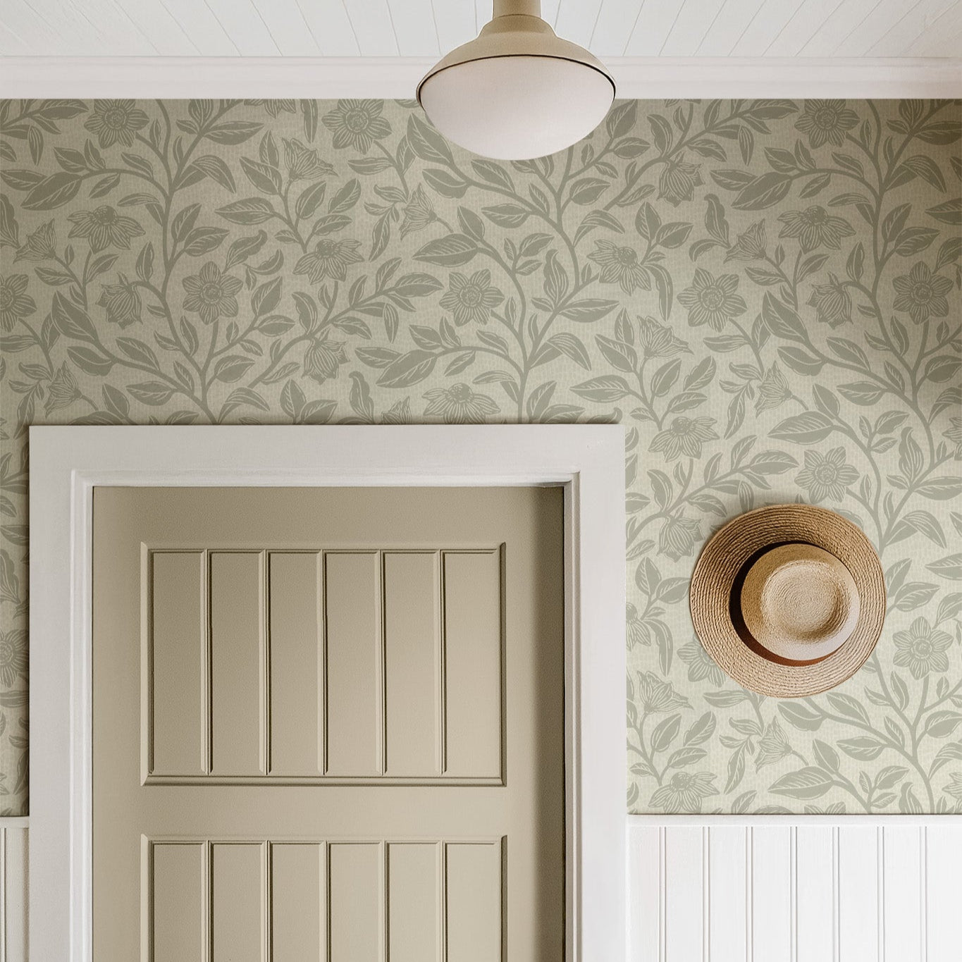 Block Printed Floral Vines Wallpaper in Sage in a bedroom