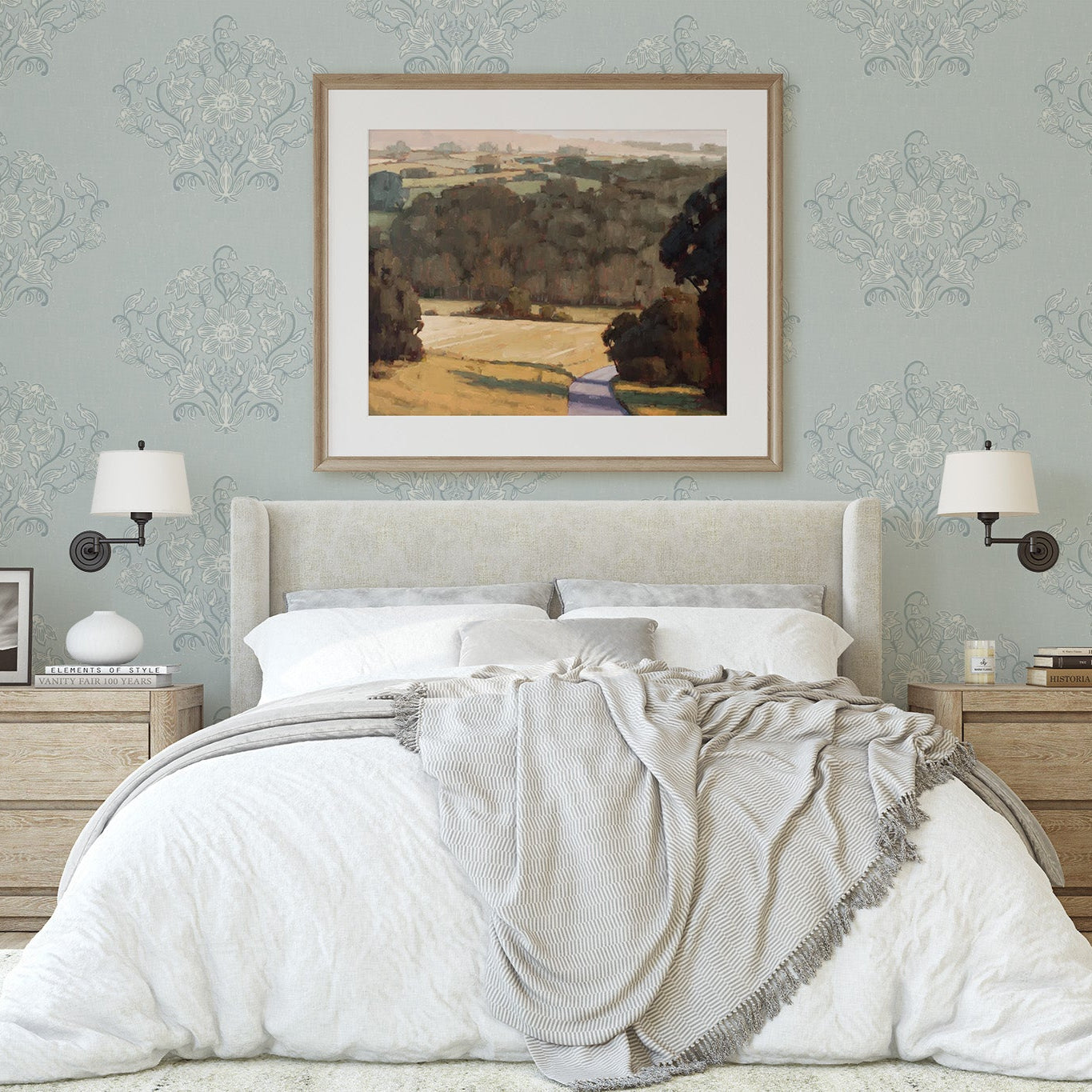 Blooming Block Print Wallpaper in Cloudy Blue shown in a bedroom.