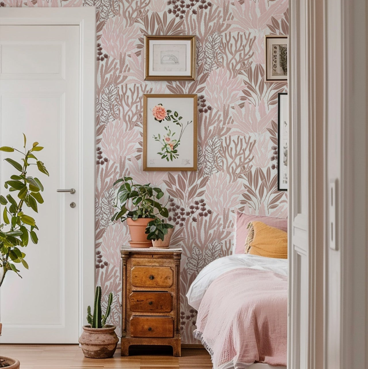 Coral Garden Wallpaper in Coral shown in a bedroom