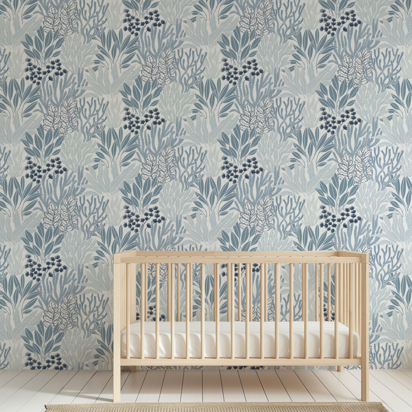 Coral Garden Wallpaper in Blue shown in a nursery