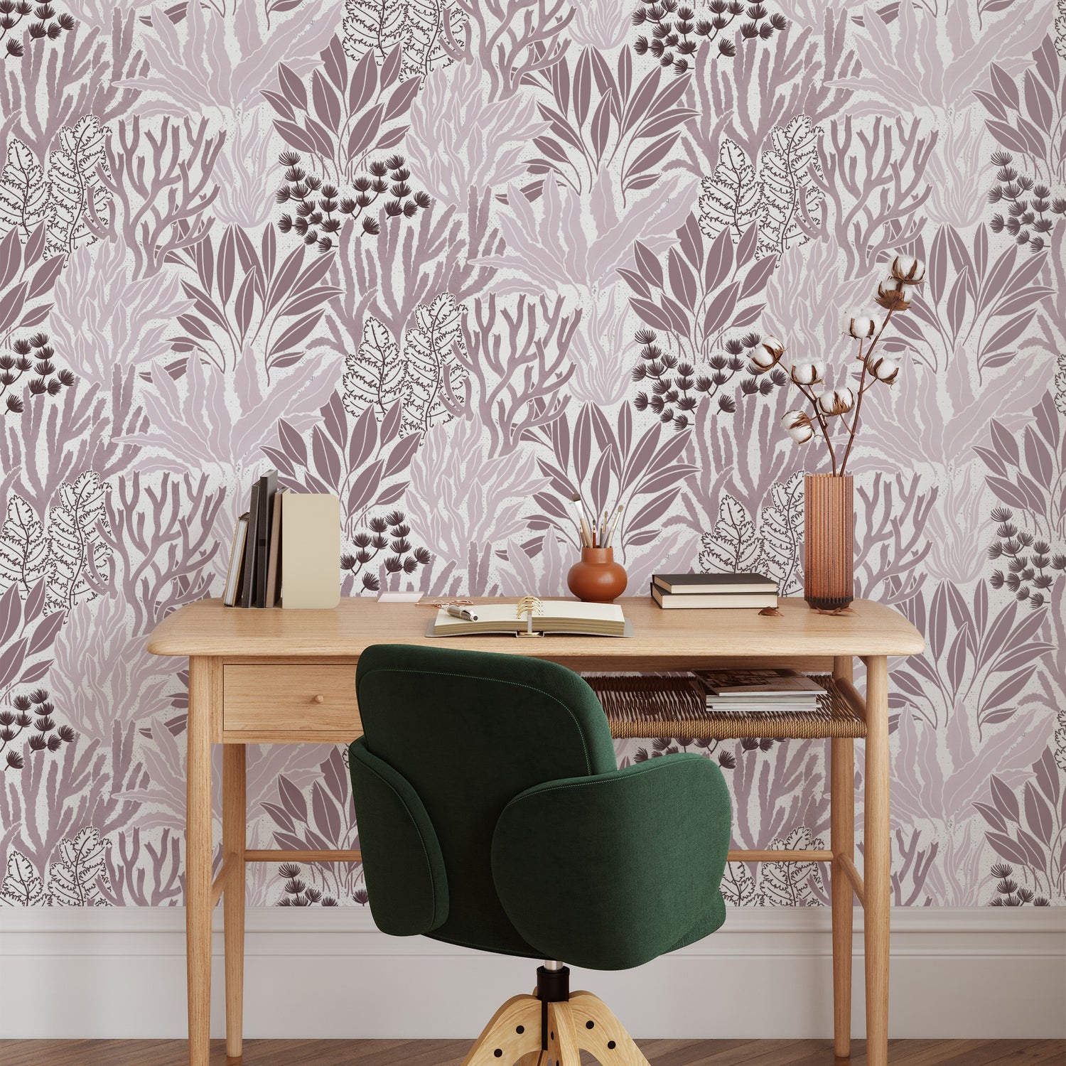 Coral Garden Wallpaper in Rosy Purple shown behind a desk
