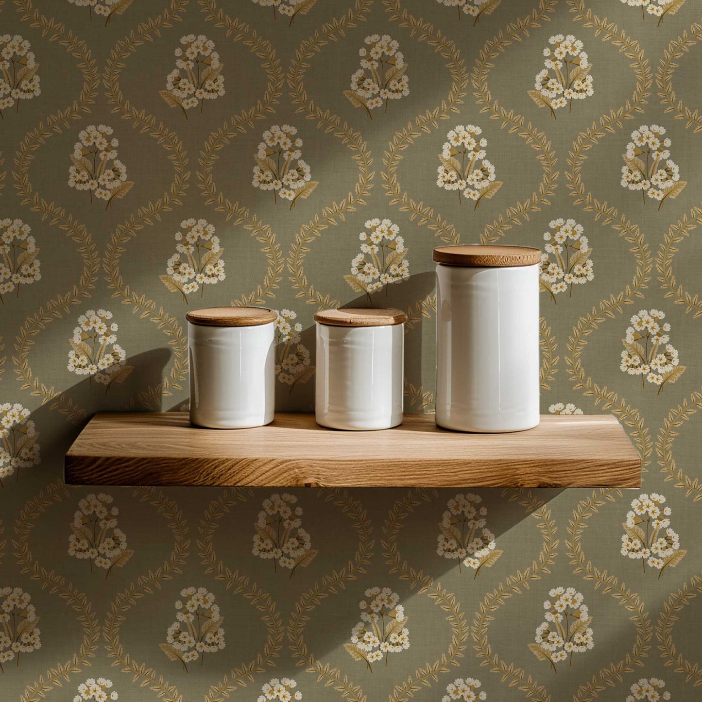Cowslip Primrose Wallpaper in Sage shown in a pantry