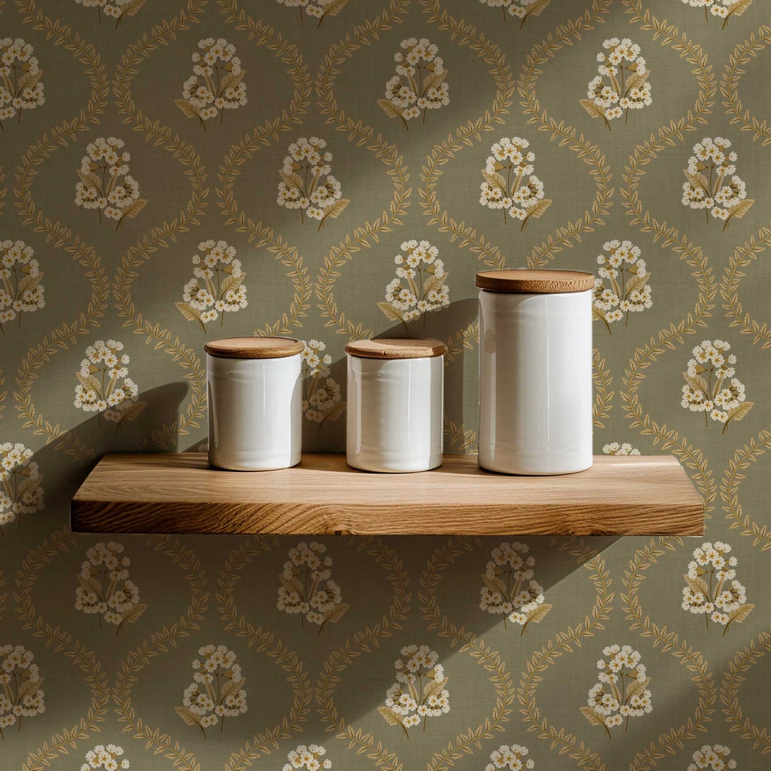 Cowslip Primrose Wallpaper in Sage shown in a pantry