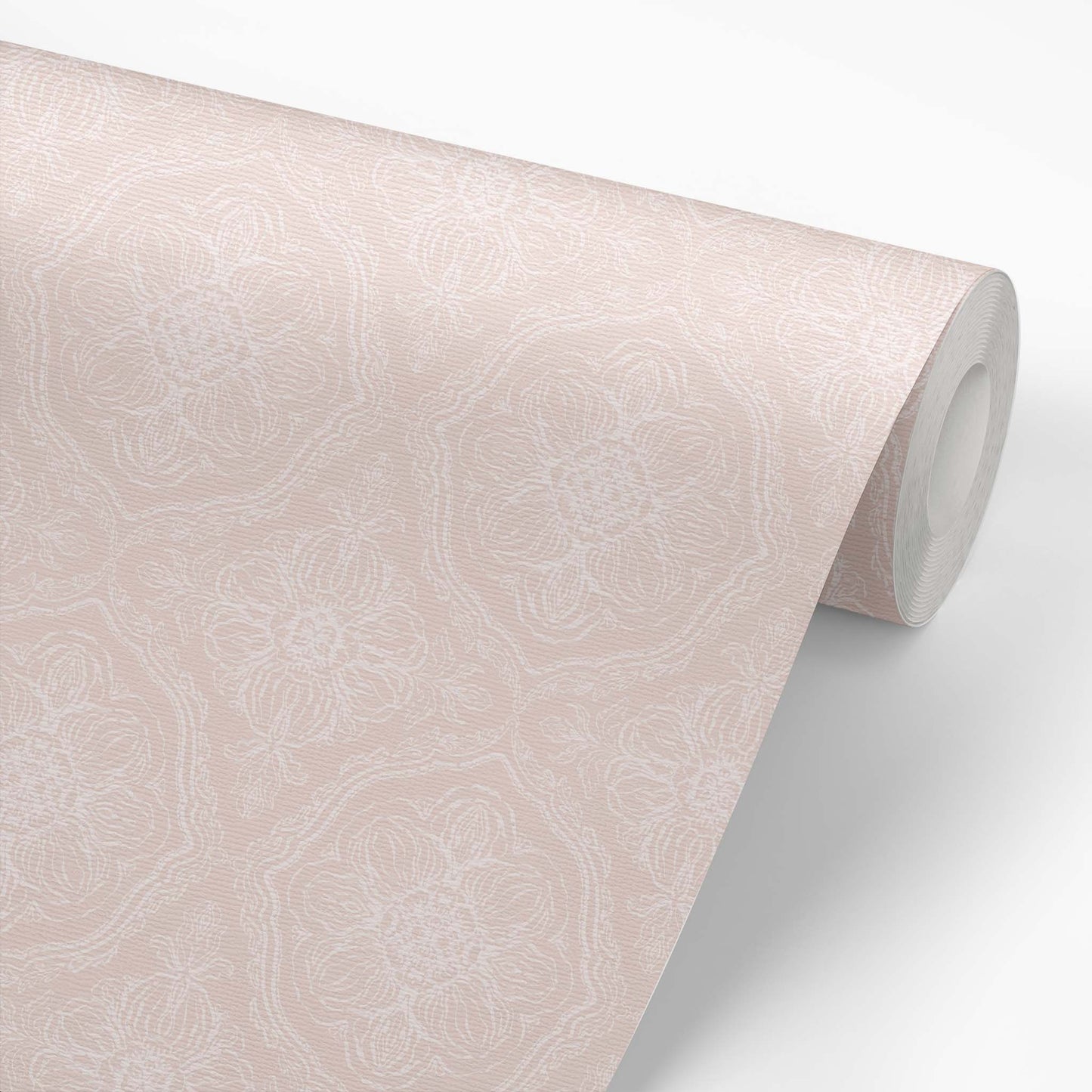 Roll of dusty pink wallpaper with a floral pattern