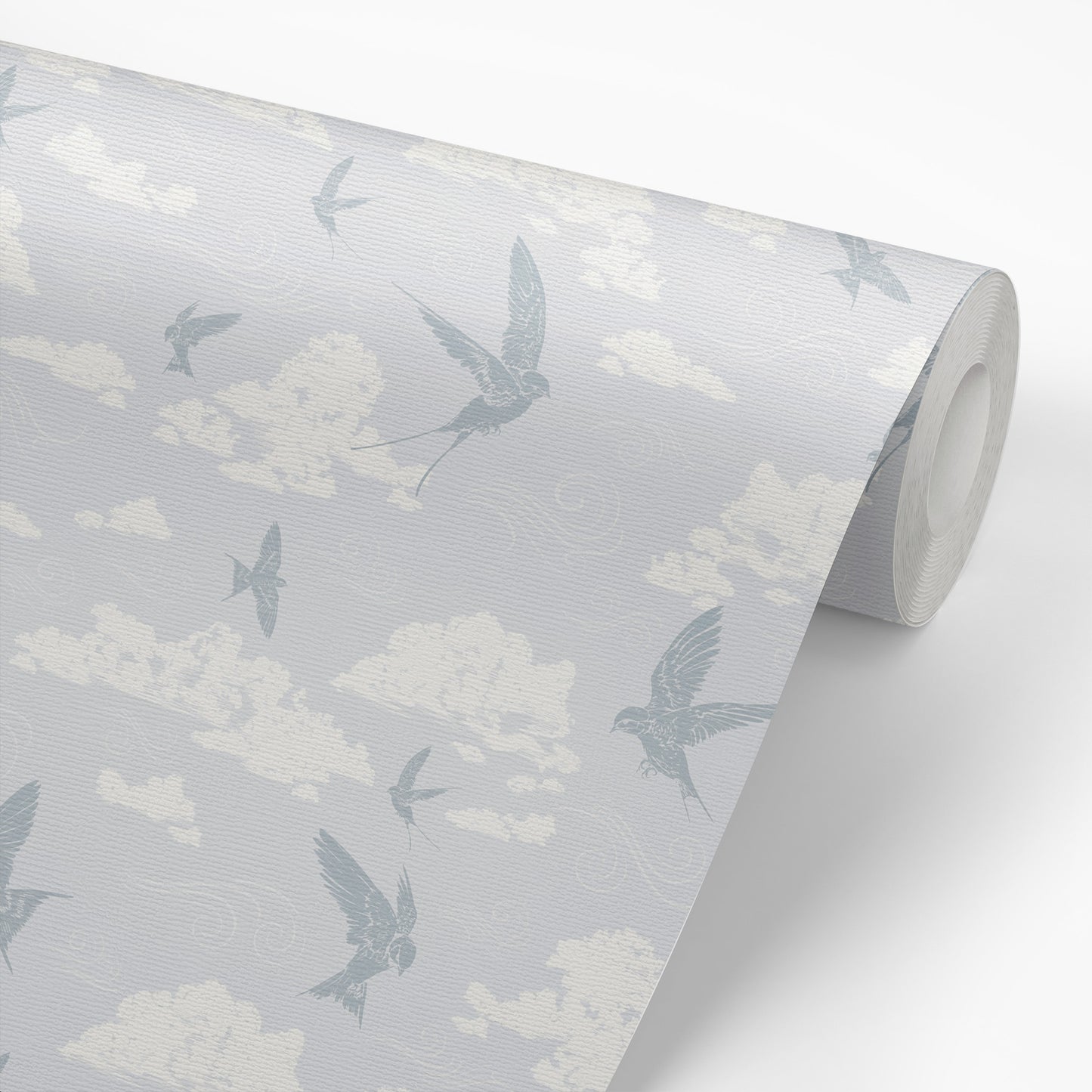 Dancing Swallows Wallpaper in Soft Blue shown on a wallpaper roll.