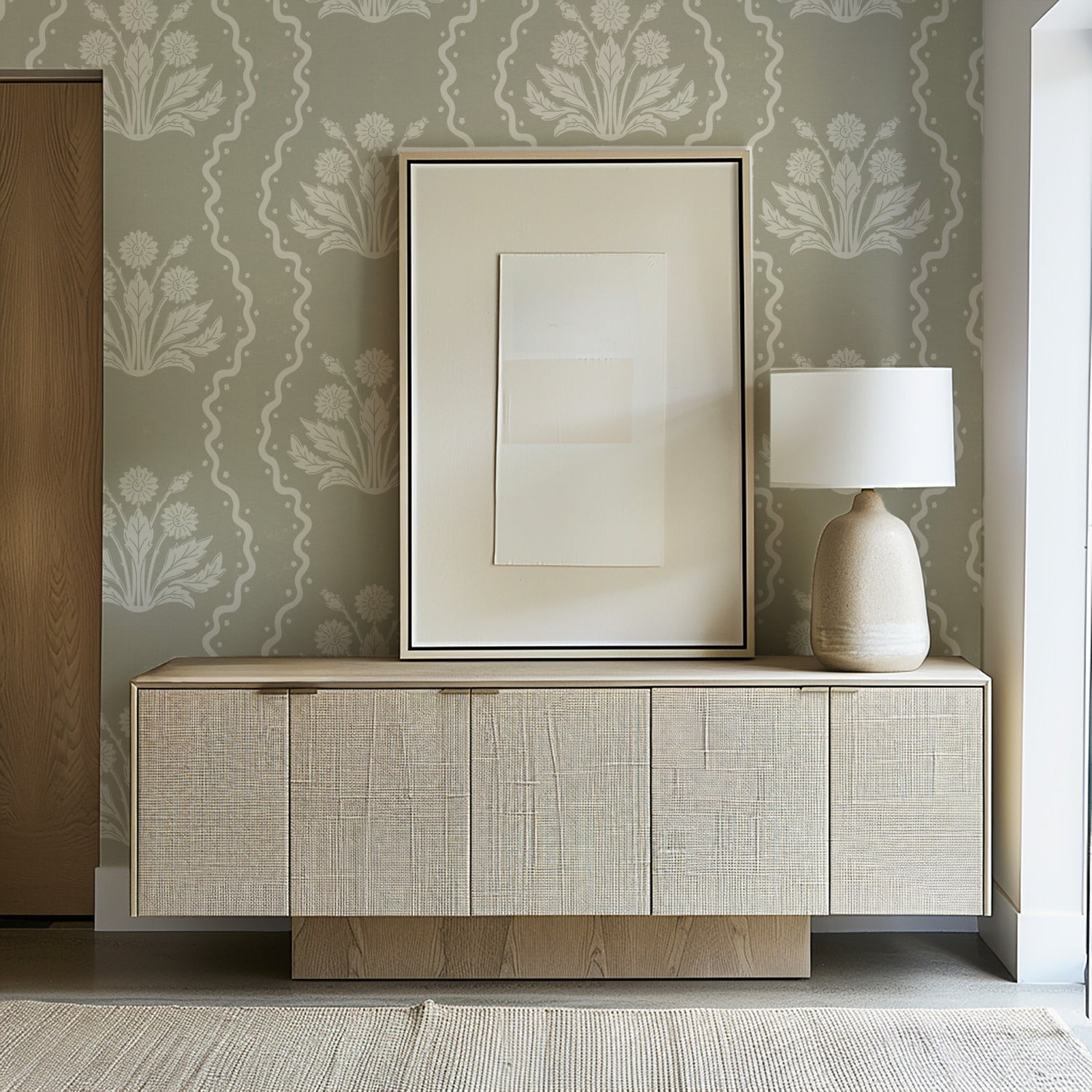 Dandelion Block Printed Wallpaper in Cream on Dry Sage shown in an entryway.