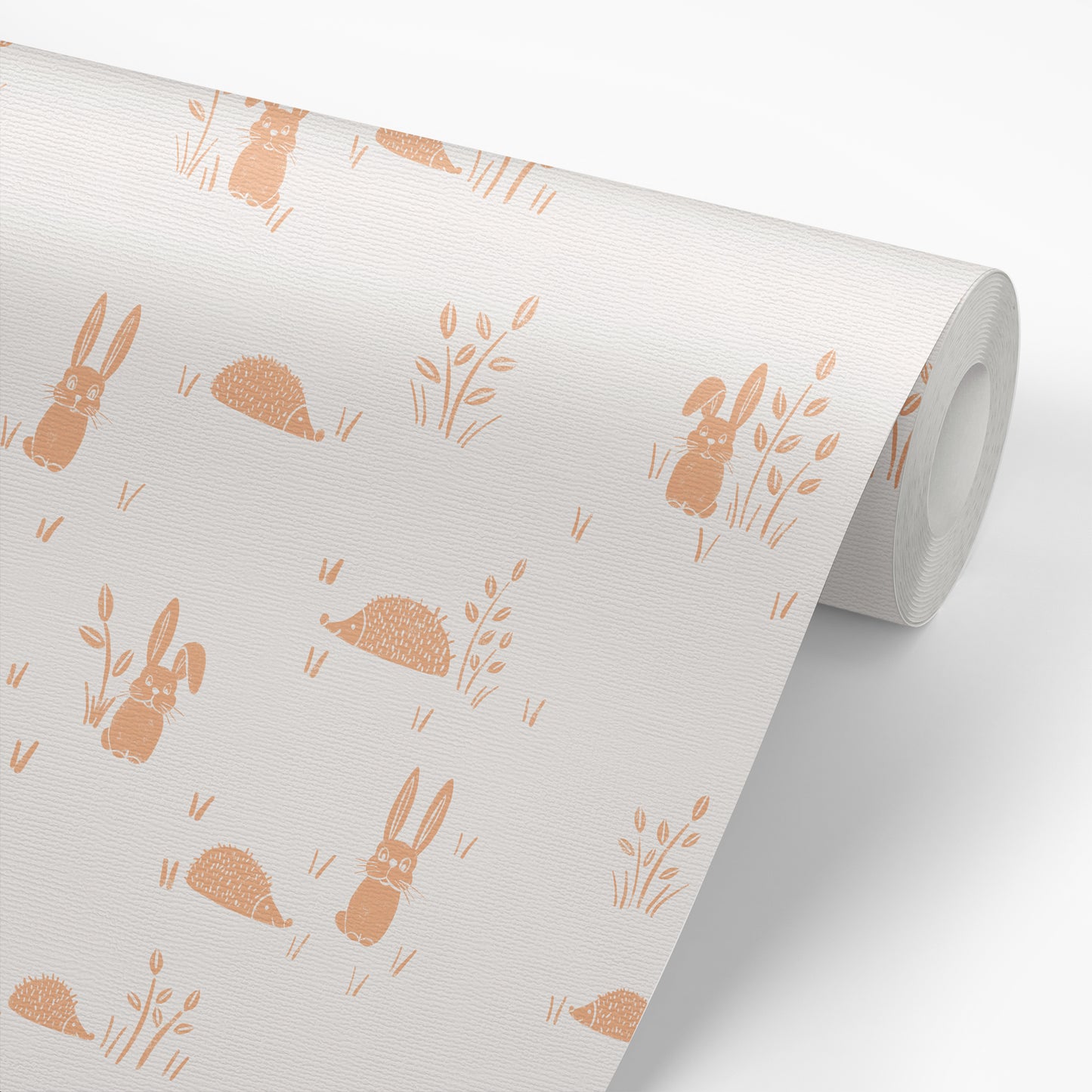 Hedgehogs and Rabbits Wallpaper in Apricot shown on a roll of wallpaper.