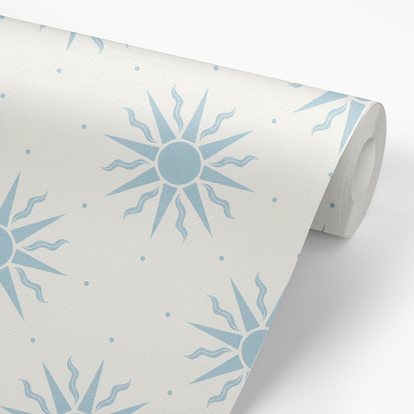 Sunny Suns Wallpaper in Blue shown on a roll of wallpaper.