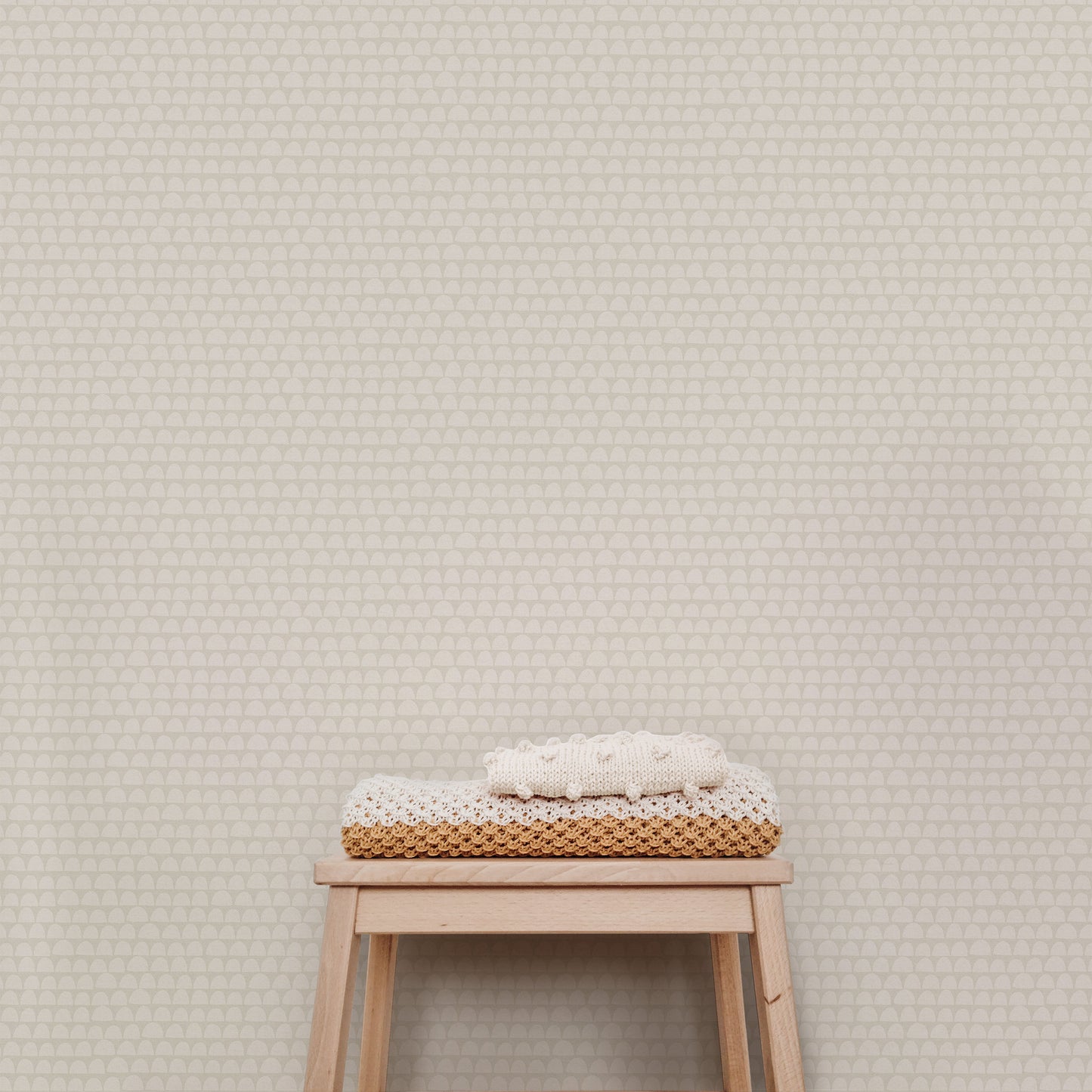 The Freehand Arches Wallpaper in Bone adds visual interest and a touch of whimsy to any room. The elegant curved motif creates a sense of depth and texture that can be appreciated from any angle, while the beige hue evokes a sense of calm and refinement.
