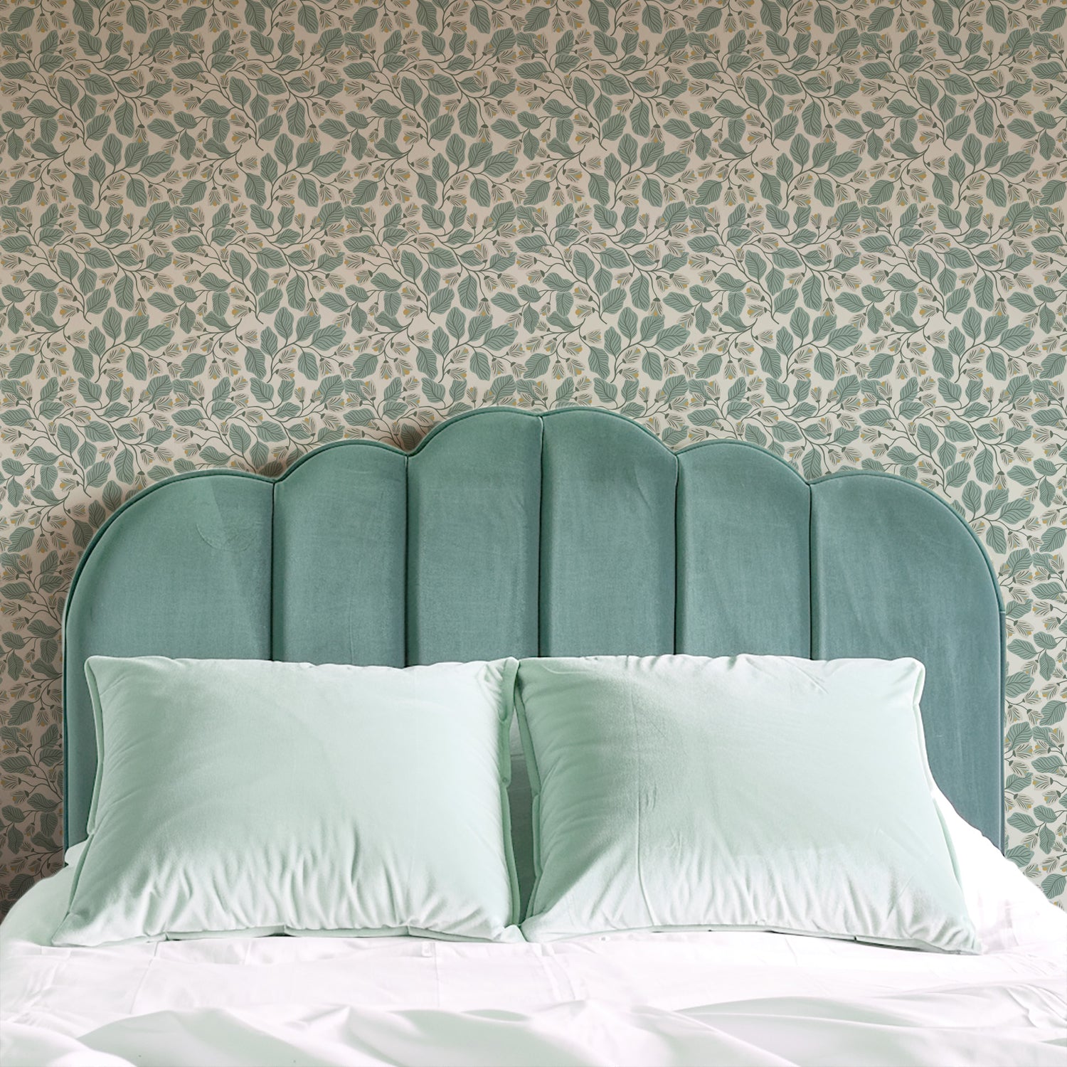 Evening Bloom Wallpaper in Sage shown in a bedroom.