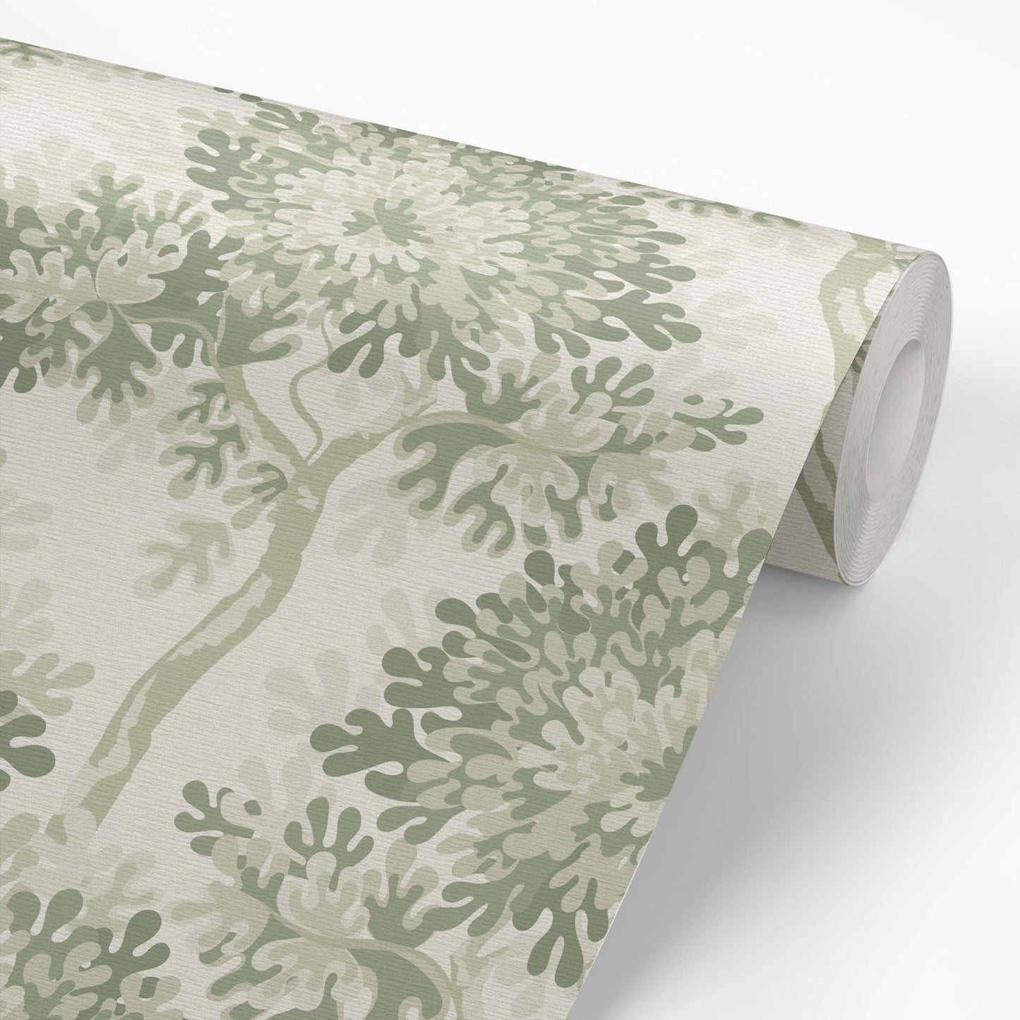 Roll of wallpaper with green leaf pattern on a white background