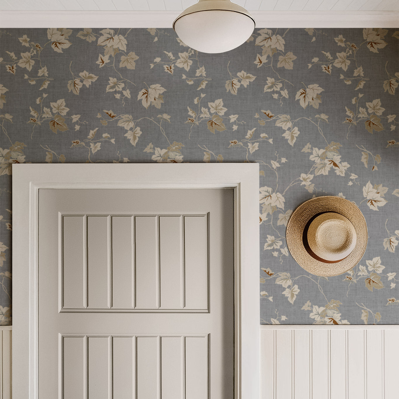 Climbing Ivy Wallpaper in Gray shown in a hallway