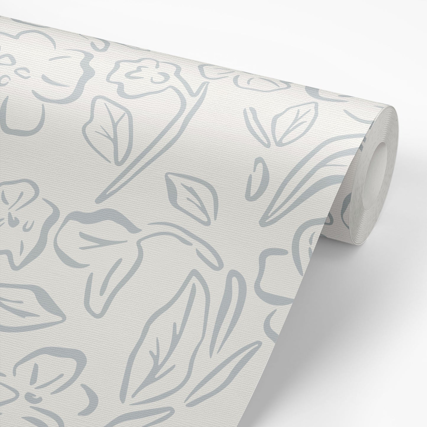 This Beverly Wallpaper in blue offers a stylish and feminine touch with its delicate floral design shown on a wallpaper roll.