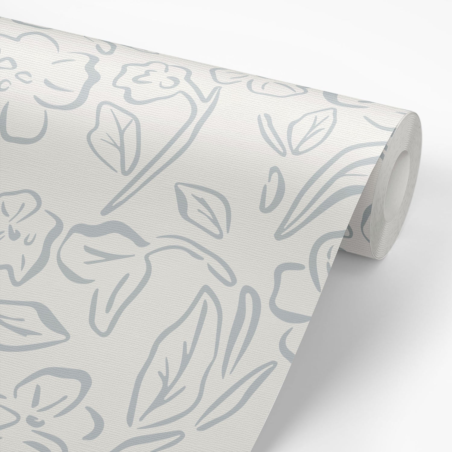 This Beverly Wallpaper in blue offers a stylish and feminine touch with its delicate floral design shown on a wallpaper roll.