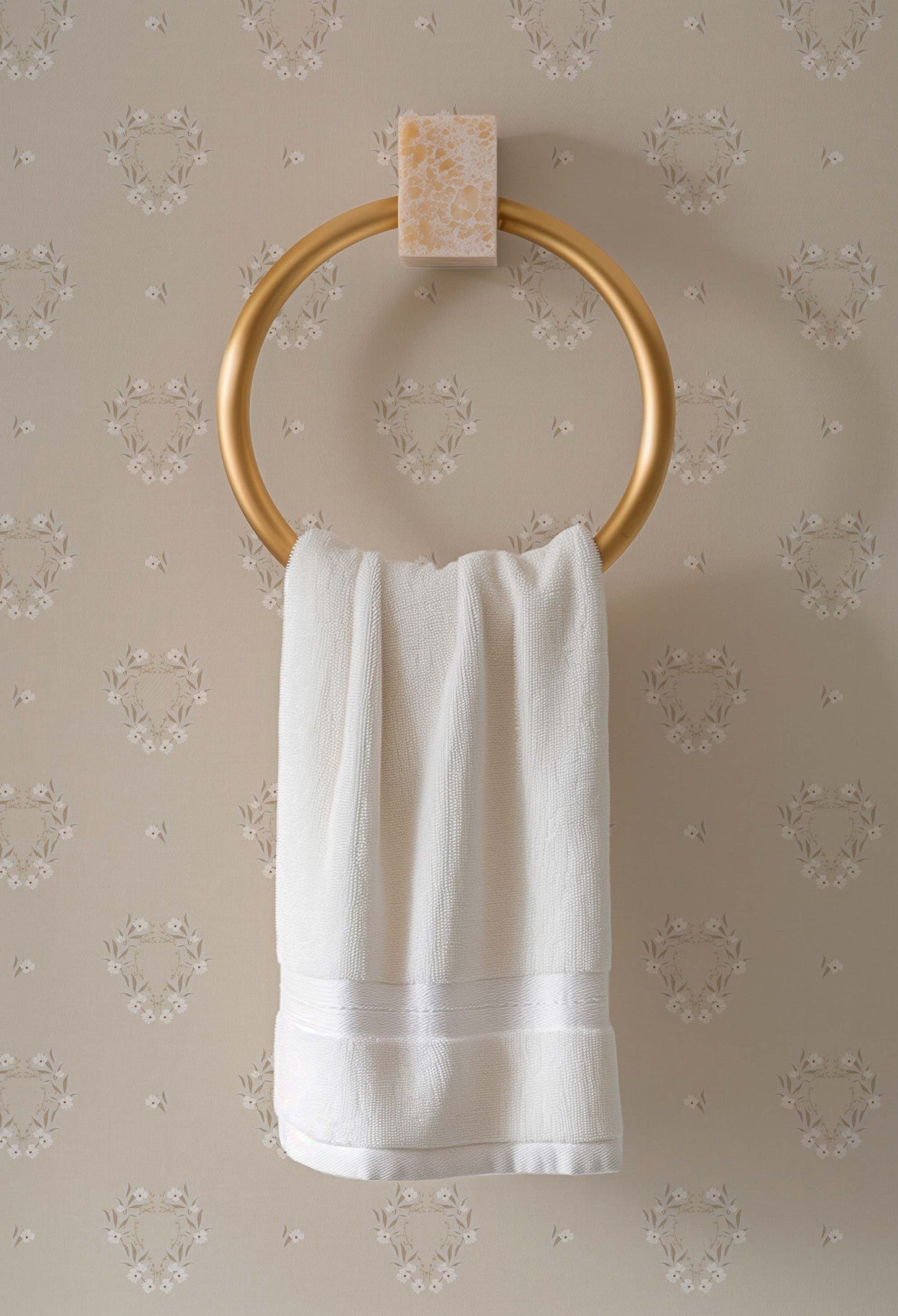 Botanical Laurel Wreath Wallpaper in Sand shown in a bathroom