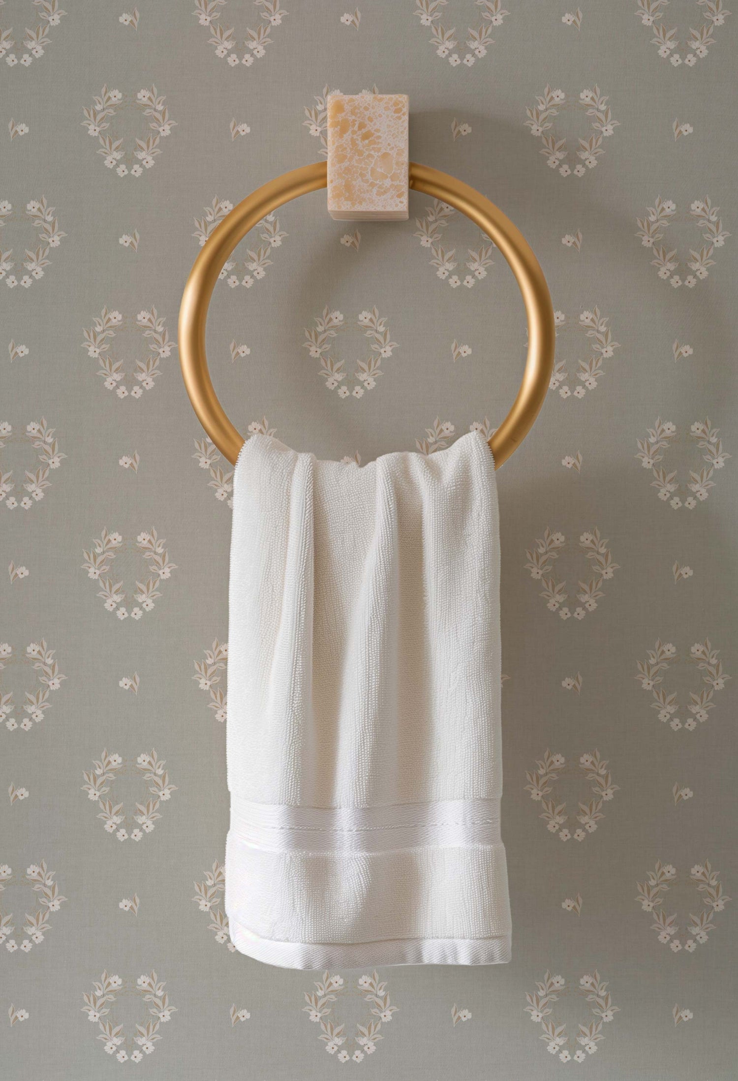 Botanical Laurel Wreath Wallpaper in Gray Sage shown in a bathroom