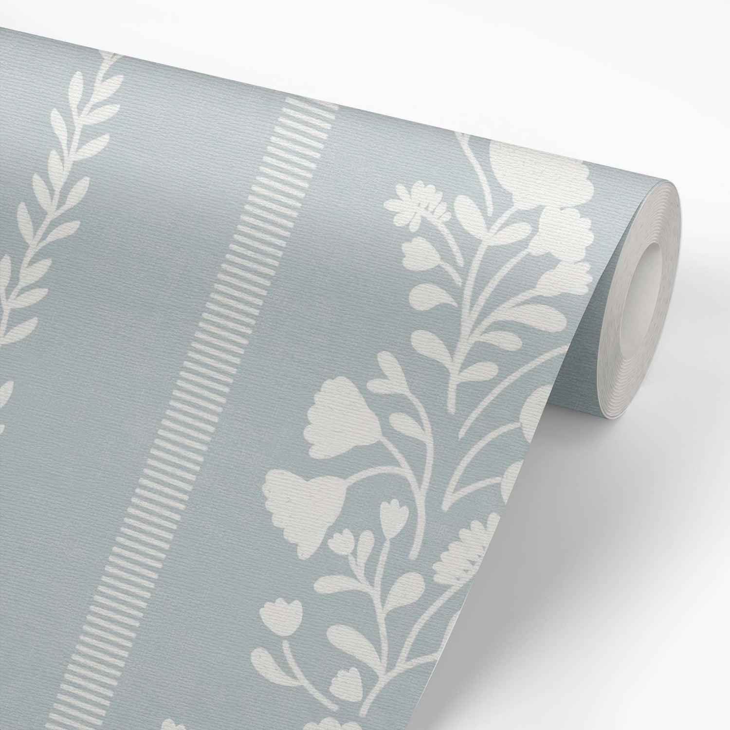 Sweet Floral Stripe Wallpaper in Cloudy Blue on a roll of wallpaper