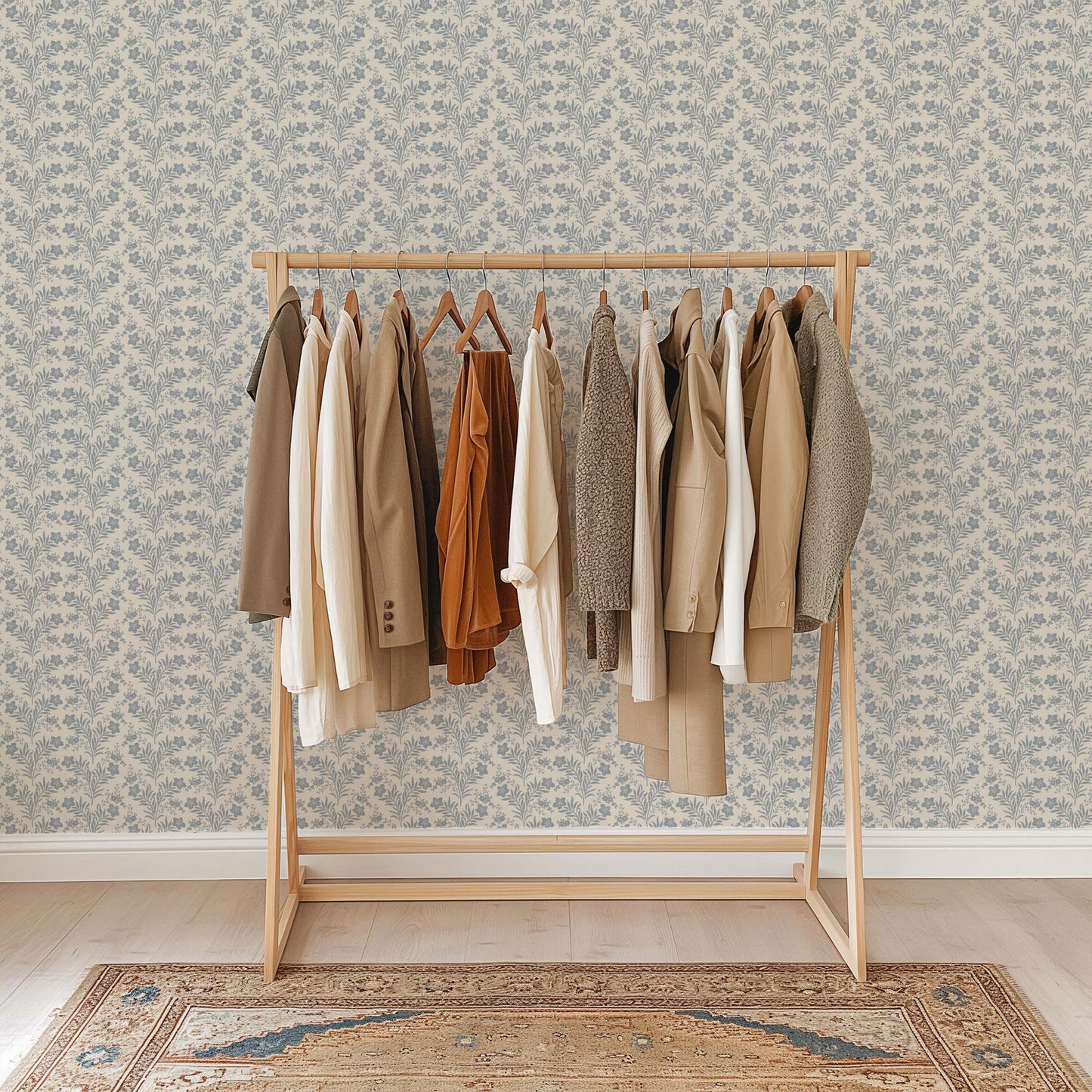 Wildflower Vines Wallpaper in Blue shown in a room.