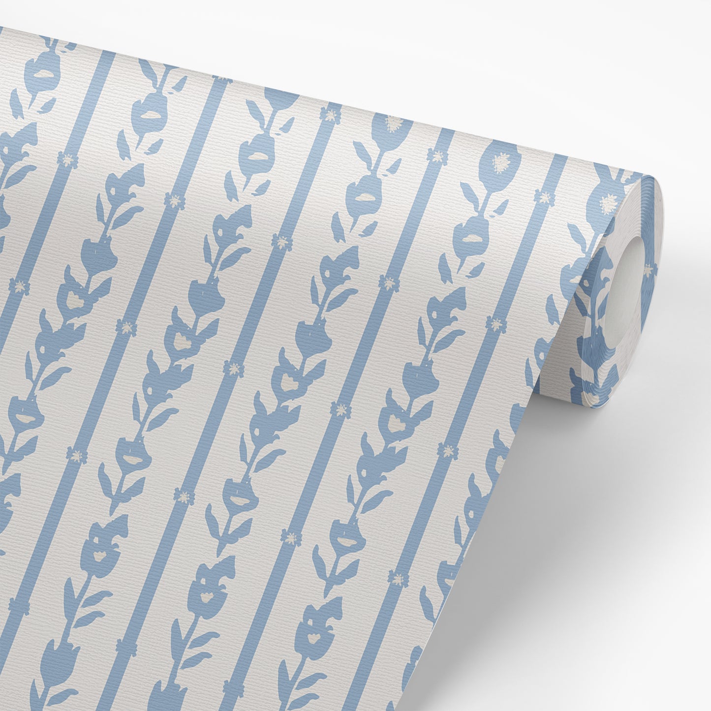 Wallpaper panel featuring our oversized floral and stripe Esme peel and stick wallpaper in light blue, grey, and off white by Jackie O'Bosky.