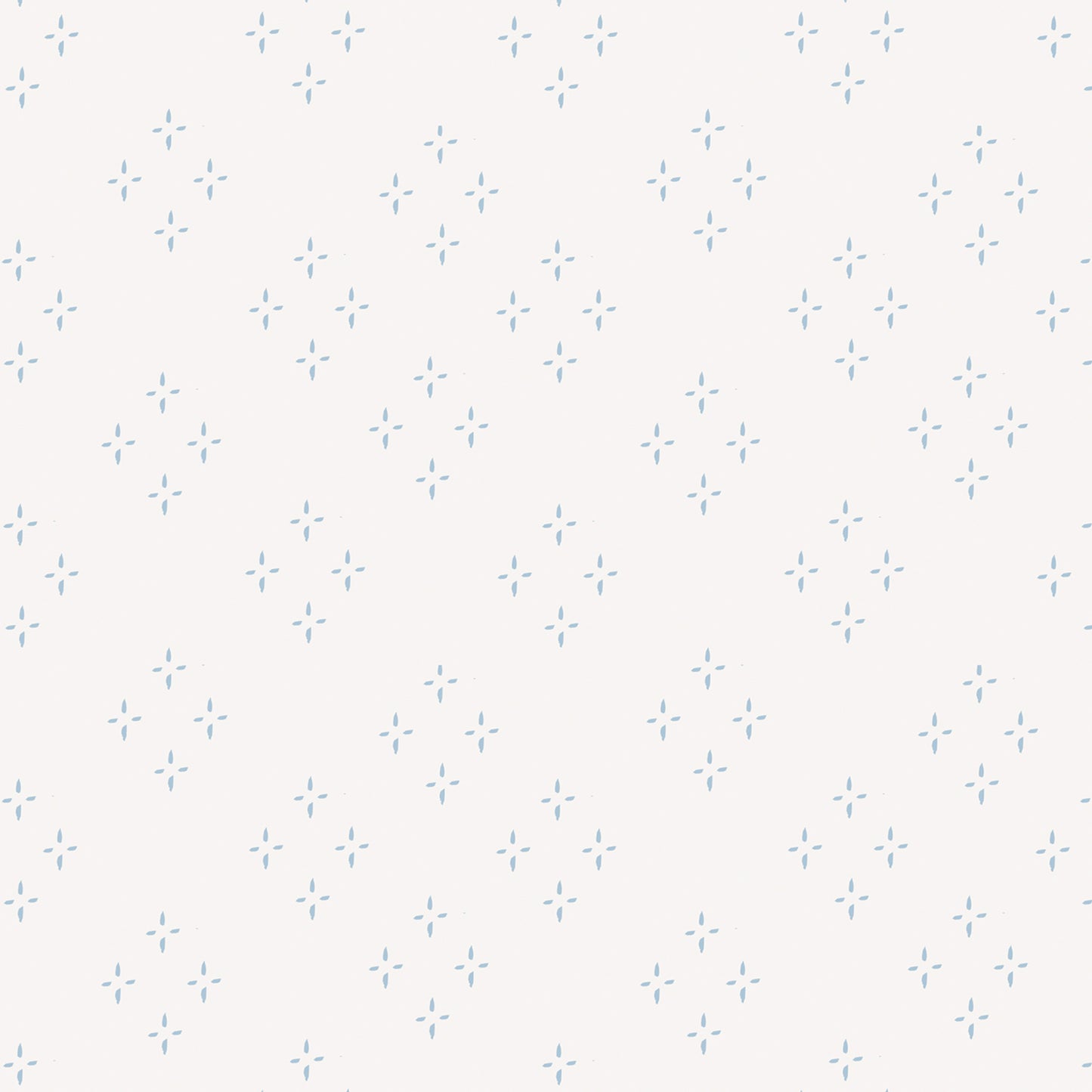 Close up featuring our diamond and star shaped Isla peel and stick wallpaper by Jackie O'Bosky. This classic pattern is made of blue dots on a creamy white background.