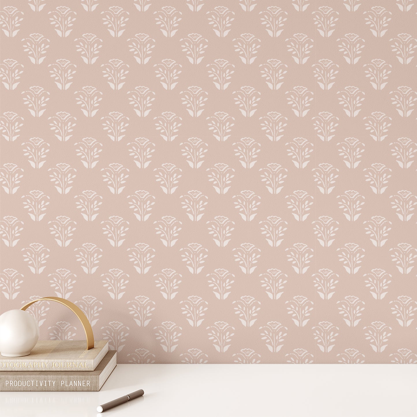 Office wall featuring our Lulu Peel and Stick Wallpaper in Nude by Jackie O'Bosky. Hand drawn floral motifs in white on a nude background.