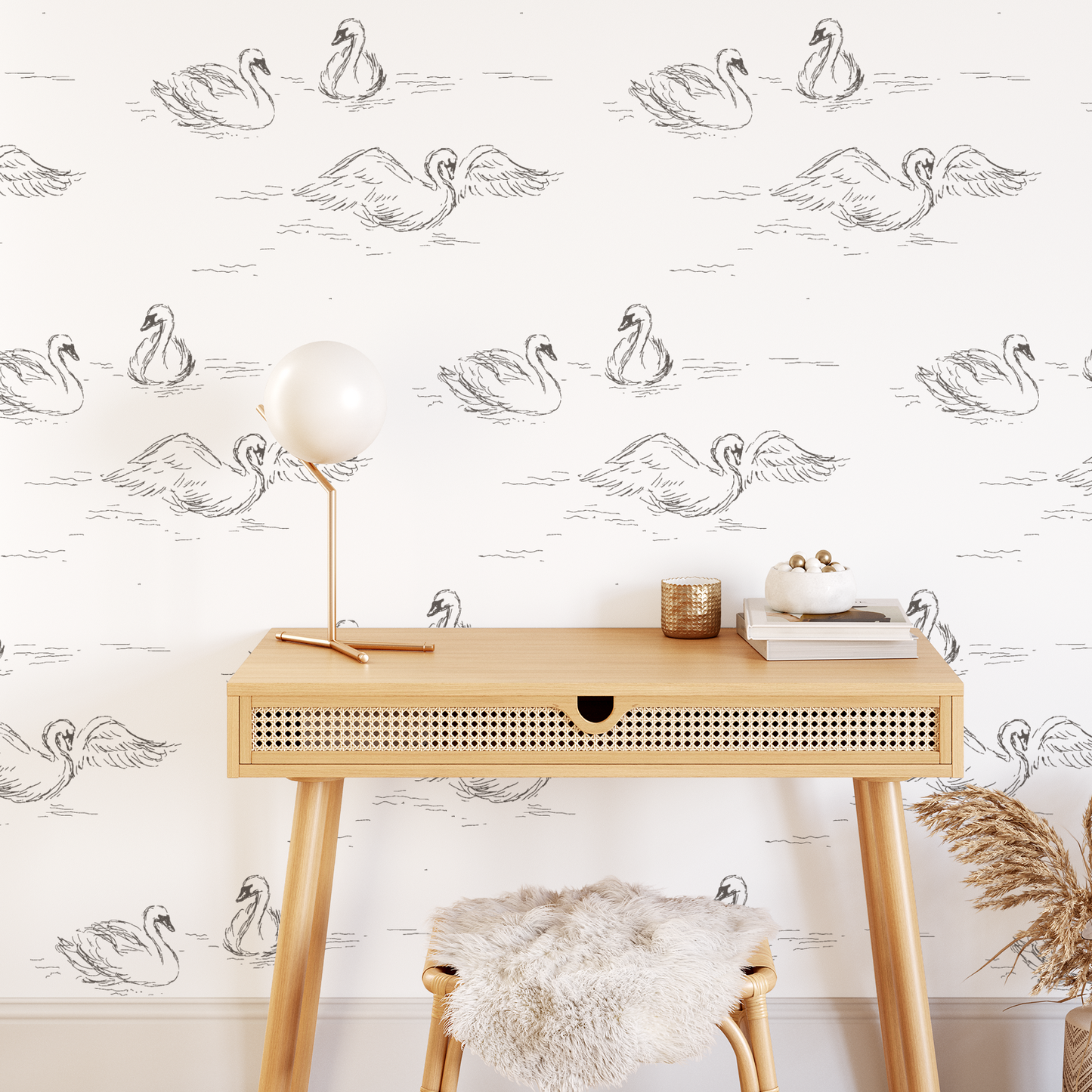 This picture shows our peel and stick, removable Swans wallpaper in cream by artist Rose Lindo and is displayed on an office wall.