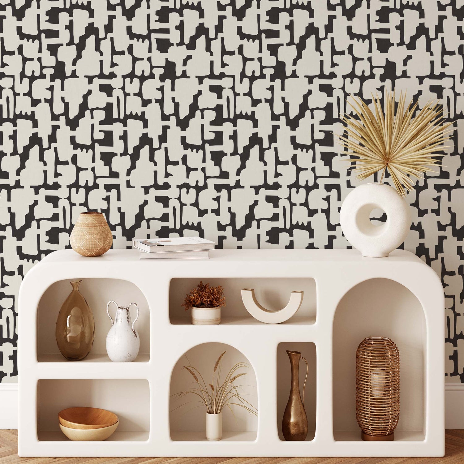 Add some eye-catching style to your walls with our Abstract Shapes Wallpaper! This modern design features an intricate blend of beige shapes on a charcoal background.