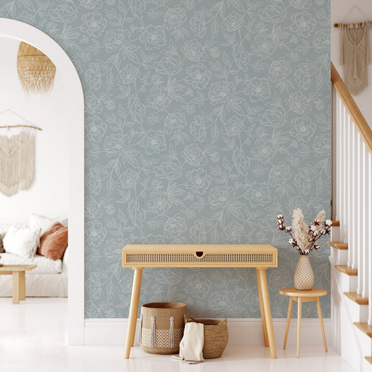 Anemone Blooms Wallpaper in Cream on Cloudy Blue shown in a hallway.