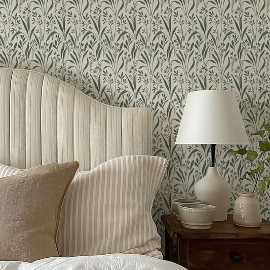 Vintage Grass Wallpaper in Lily Pad Green shown in a bedroom