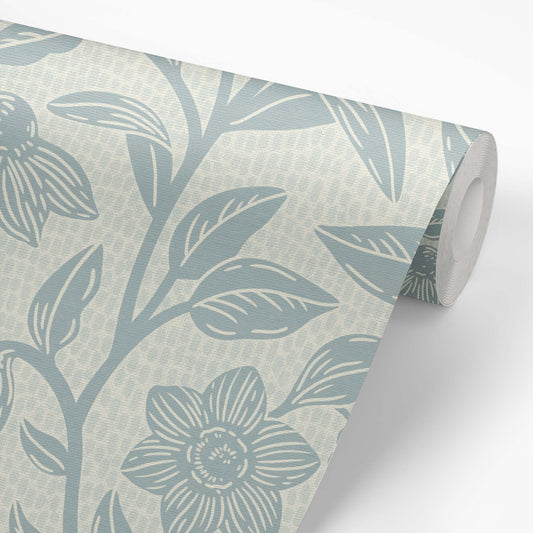 Block Printed Floral Vines Wallpaper in Cloudy Blue shown on a roll of wallpaper