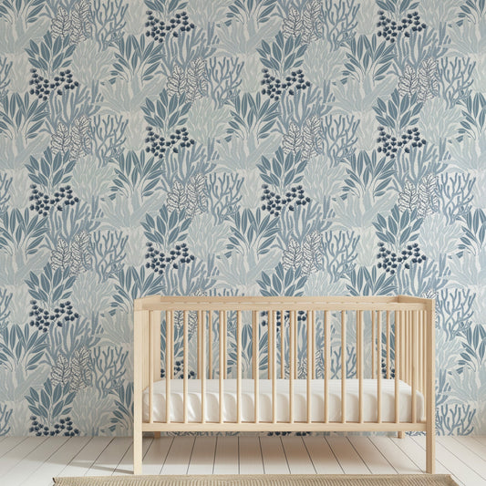 Coral Garden Wallpaper in Blue shown in a nursery