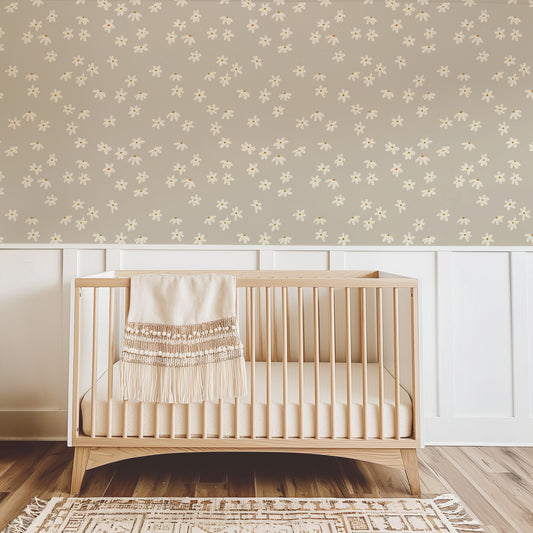 Daisy Doodles Wallpaper in Taupe shown in a nursery.