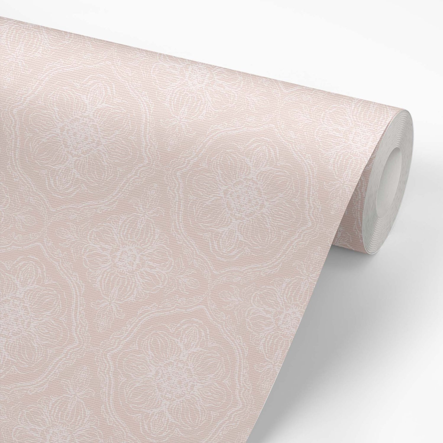 Roll of dusty pink wallpaper with a floral pattern
