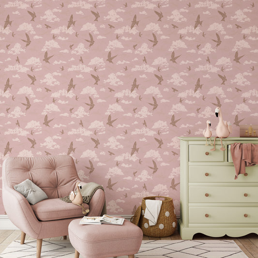 Dancing Swallows Wallpaper in Dusty Pink shown in a nursery.