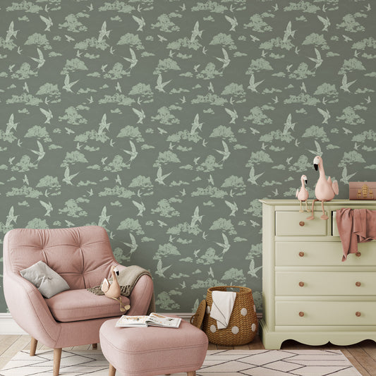 Dancing Swallows Wallpaper in Sage shown in a nursery.