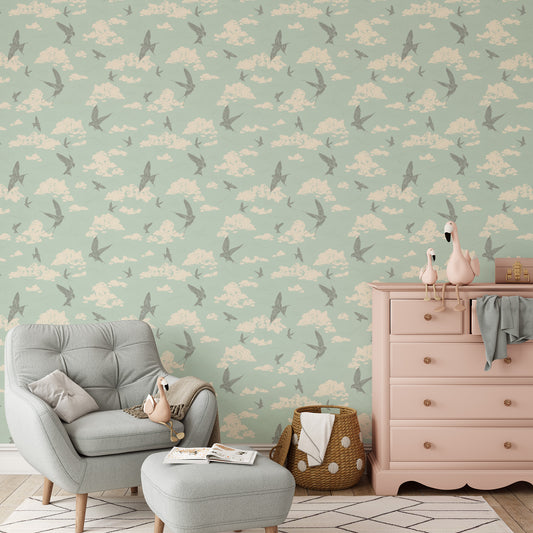 Dancing Swallows Wallpaper in Seafoam shown in a nursery.