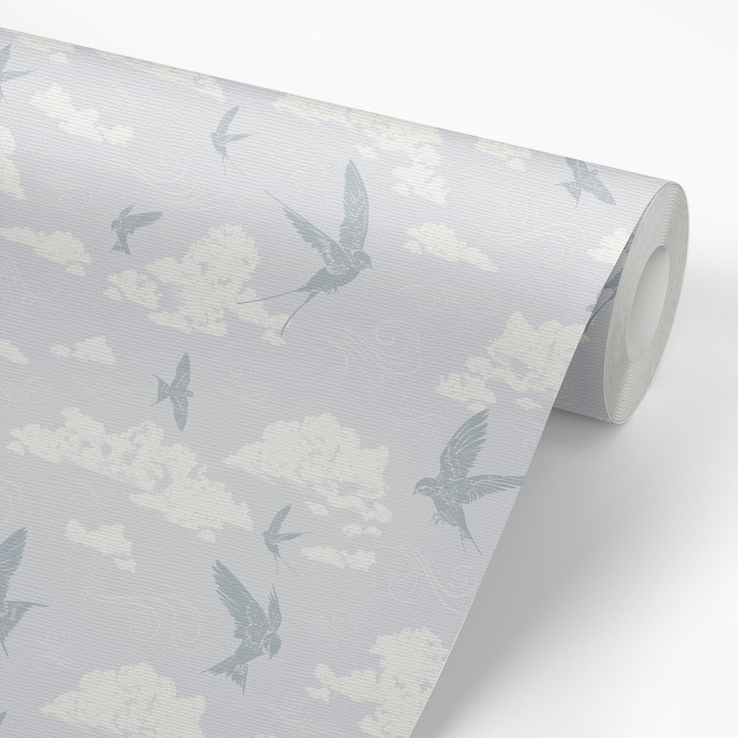 Dancing Swallows Wallpaper in Soft Blue shown on a wallpaper roll.