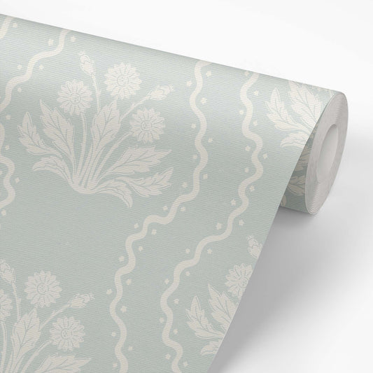 Dandelion Block Printed Wallpaper in Seafoam shown on a wallpaper roll.