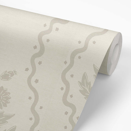 Dandelion Block Printed Wallpaper in Beige shown on a wallpaper roll.