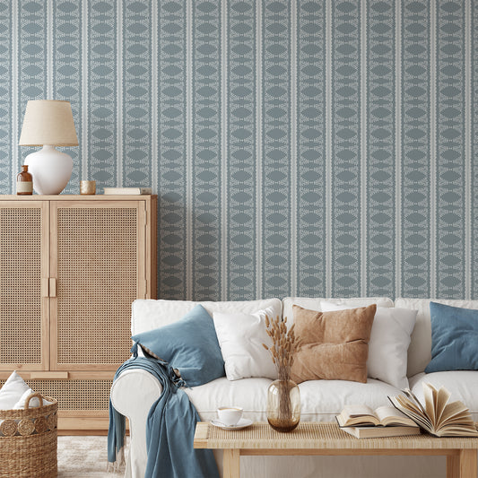 Scalloped Victorian Stripe Wallpaper in blue shown in a living room.