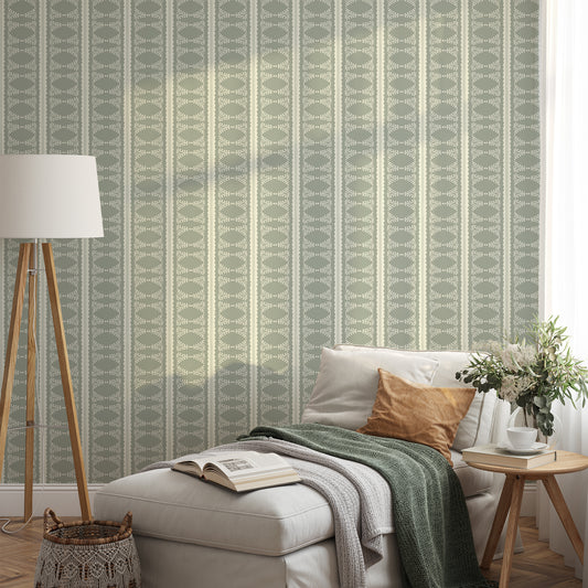 Scalloped Victorian Stripe Wallpaper in Sage shown in a living room.