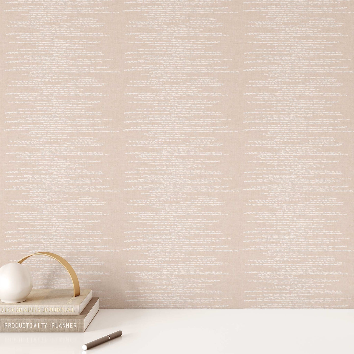 Dotted Lines Wallpaper in Soft Coral shown on an office wall