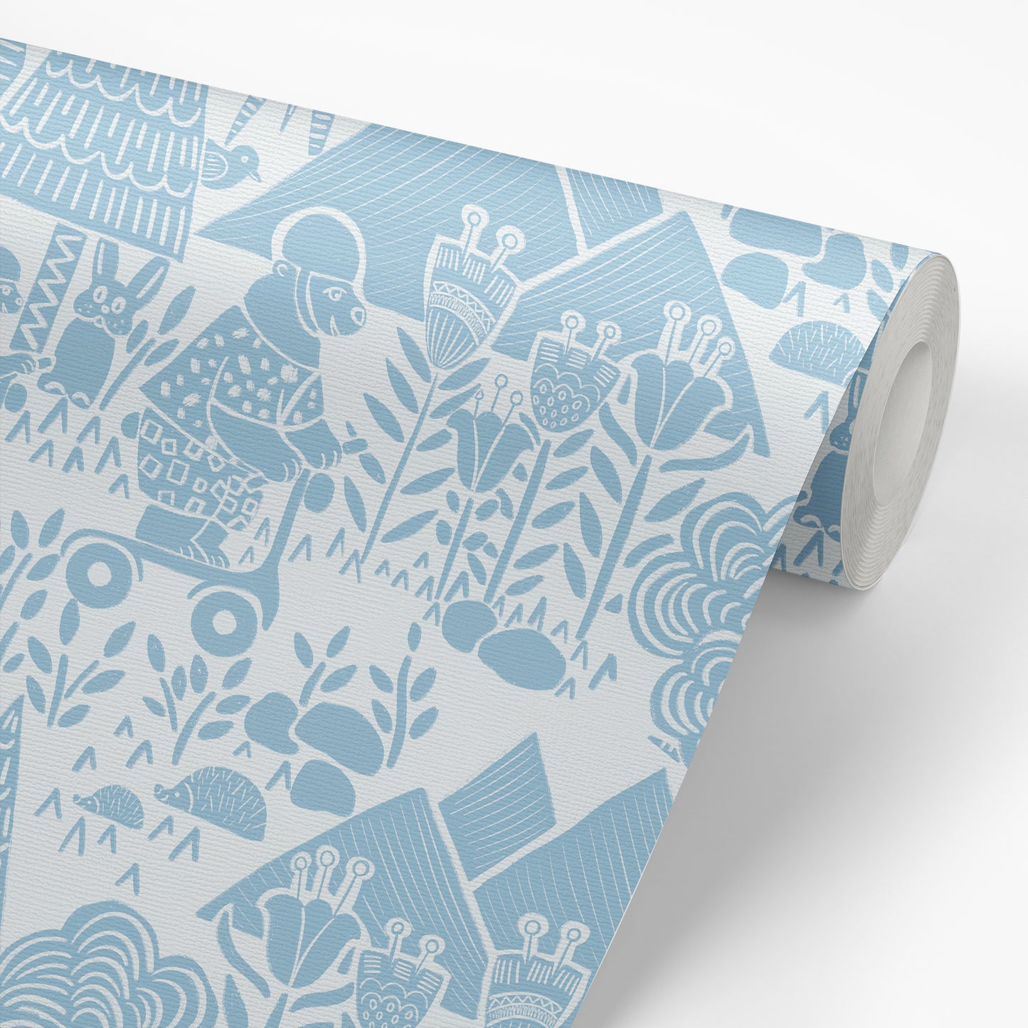 Scooting Bears Wallpaper in Blue shown on a roll of wallpaper.