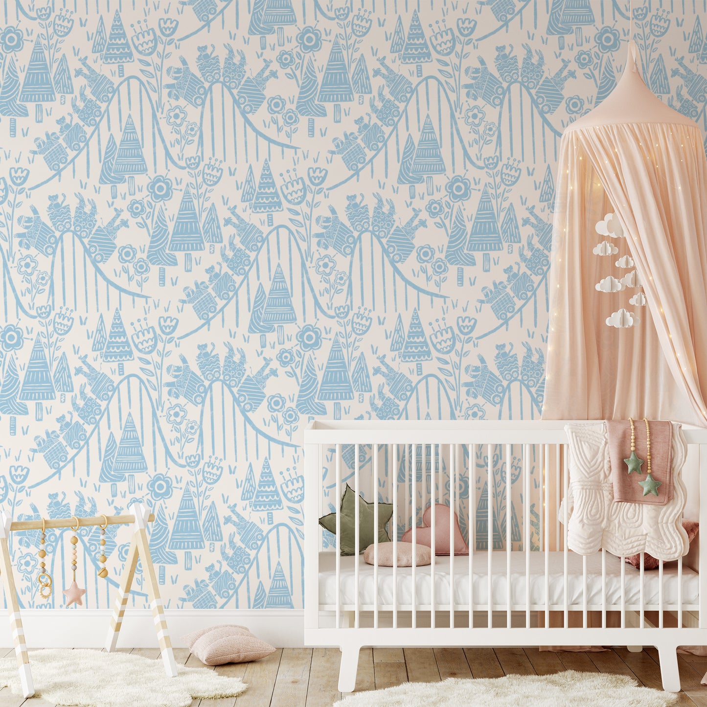In the Theme Park Wallpaper in Blue shown in a nursery.