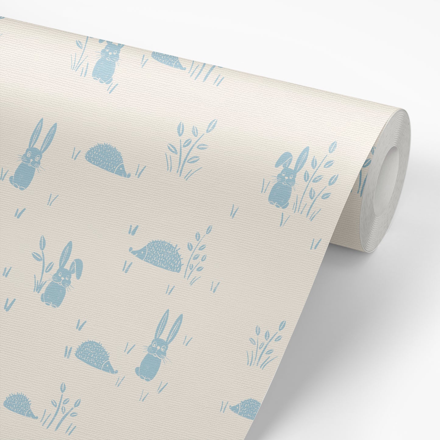 Hedgehogs and Rabbits Wallpaper in Blue shown on a roll of wallpaper.