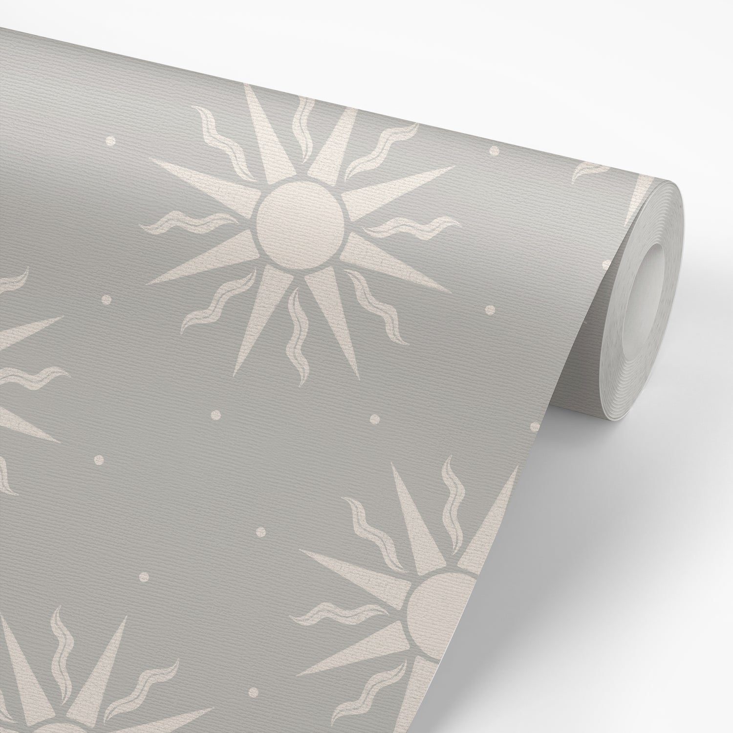 Sunny Suns Wallpaper in Gray shown on a roll of wallpaper.